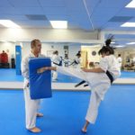 practicing karate kicks