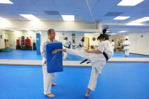 practicing karate kicks